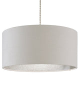 A large cylinder lampshade with a ribbed texture and just visible lining in silver glitter. The lampshade is hanging from a grey twisted cable and is taken against a white background.